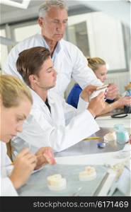 Workers in a dental laboratory