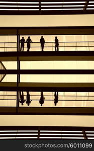 workers inside the modern building in silhouette&#xA;