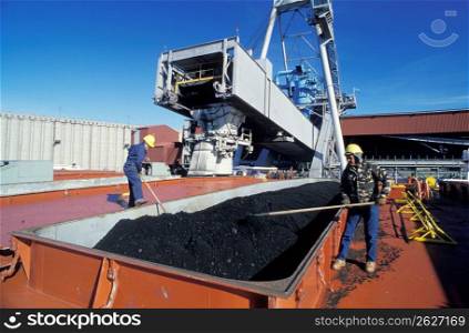 Workers loading coal