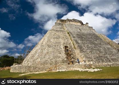 Workers restoring a pyramid, Pyramid of the Magician, Uxmal, Yucatan