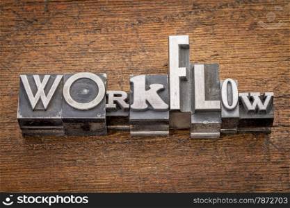 workflow word in mixed vintage metal type printing blocks over grunge wood