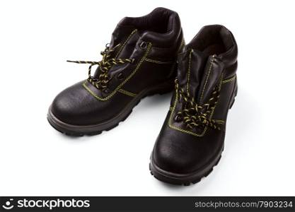 Working boots of black color with a yellow line isolated on a white background