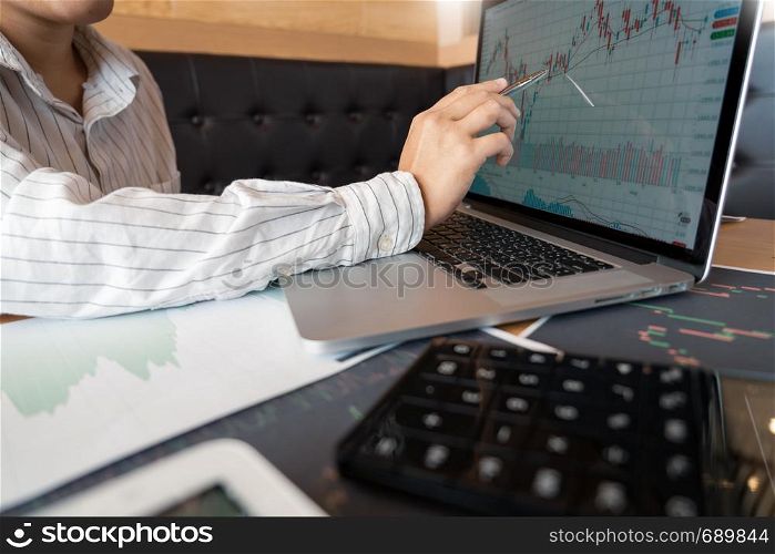 Working business man of broker or traders thinking about forex on multiple computer screens of stock market invest trading financial graph charts data analysis
