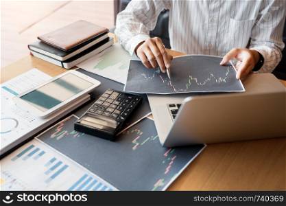 Working business man of broker or traders thinking about forex on multiple computer screens of stock market invest trading financial graph charts data analysis