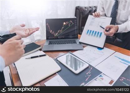 Working business man, team of broker or traders talking about forex on multiple computer screens of stock market invest trading financial graph charts data analysis.