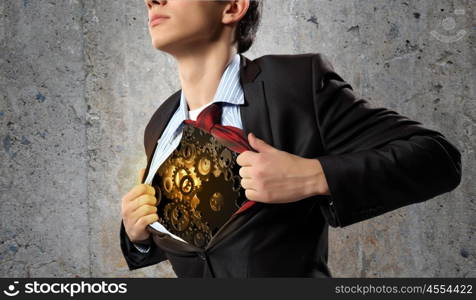 Working mechanism. Close up of businessman acting like superhero