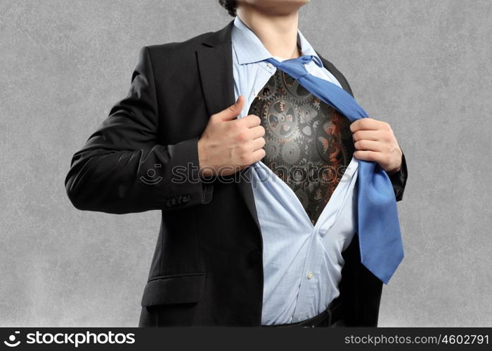 Working mechanism. Close up of businessman acting like superhero