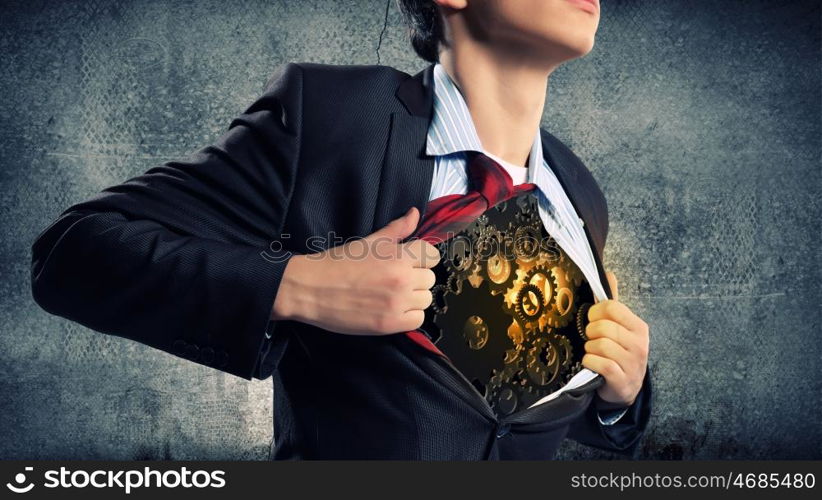 Working mechanism. Close up of businessman acting like superhero