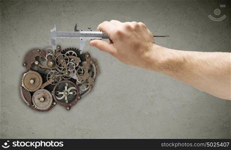 Working mechanism. Close up of hand with wrench fixing mechanism