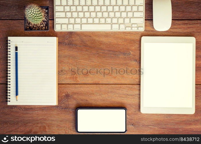 Working place. desktop, notebook, phone and tablet for table setting.
