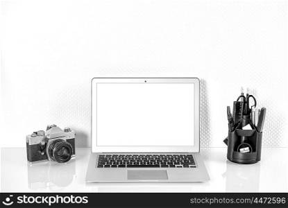 Working station with office supplies and analoge vintage Camera. Workplace Mock Up with product display screen