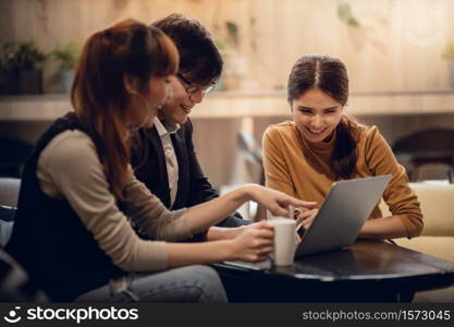 Working Together Concept. Group of Asian Business People Working on Laptop in Office. Happy Teamwork