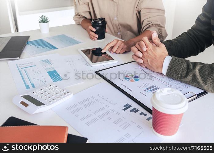 Working together on project, Two young business colleagues working or meeting with partner discussing financial documents and idea