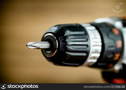 Working tool. Screwdriver. On a wooden background. High quality photo. Working tool. Screwdriver. On a wooden background.