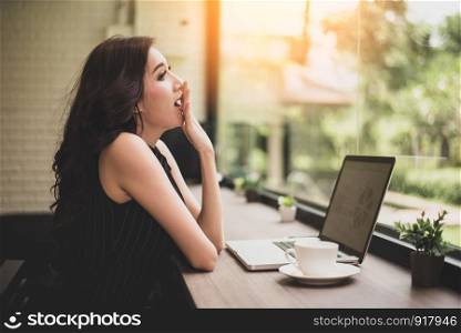 Working woman yawning in workplace. Business and Lifestyle concept. Technology and people concept. Mood and gesture theme.