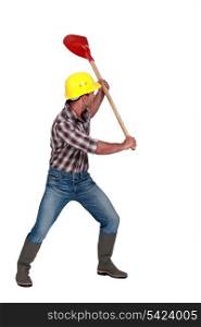 Workman brandishing a shovel on white background