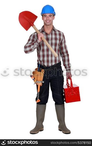 Workman holding shovel