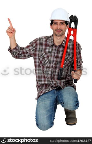 Workman kneeling, studio shot