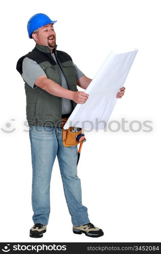 Workman laughing at plans