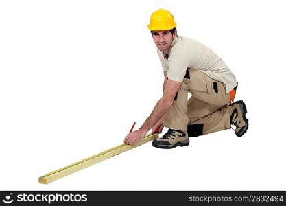 Workman taking measurements