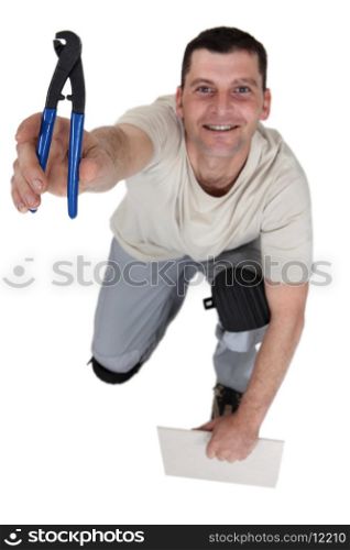 Workman with a pair of pliers
