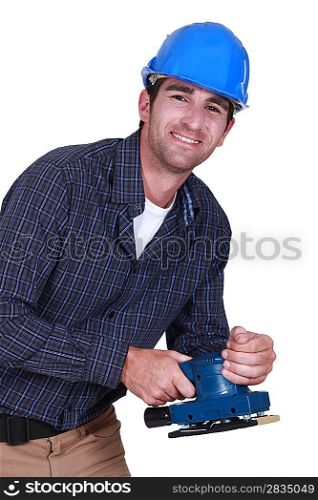Workman with an electric sander