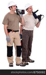 Workmen holding drills