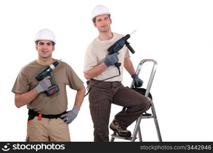 Workmen holding their electric screwdrivers