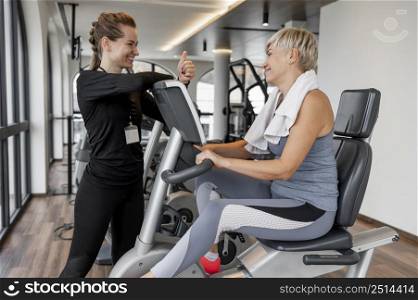 workout program trainer client using bicycle