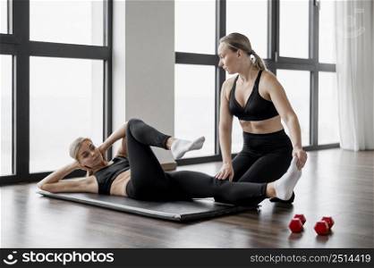 workout with personal trainer bicycle exercise