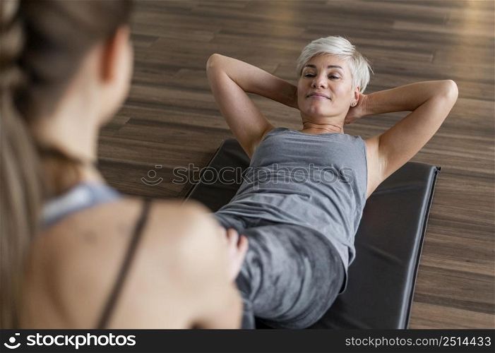 workout with personal trainer high view crunches