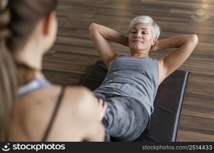 workout with personal trainer high view crunches