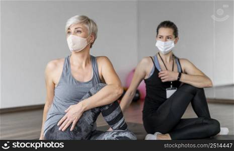 workout with personal trainer wearing masks