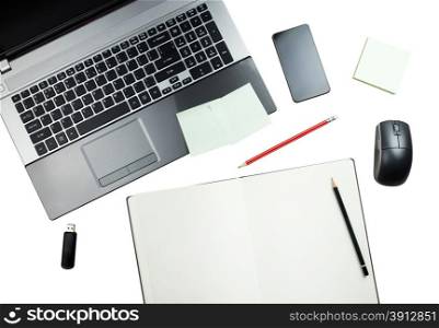 Workplace, laptop and notepad with pencils isolated on white background