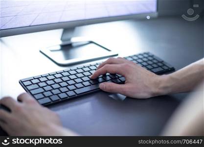 Workplace of a freelancer: Arrangement of computer, keyboard and typing hands