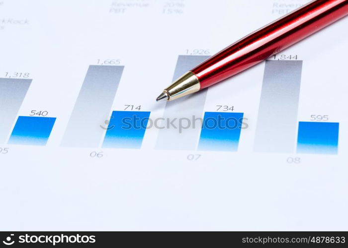 Workplace with documents. Close up of papers with graphs and diagrams