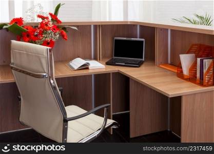 workplace with laptop in modern office