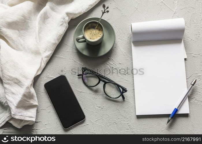 workplace with smartphone blank notepad