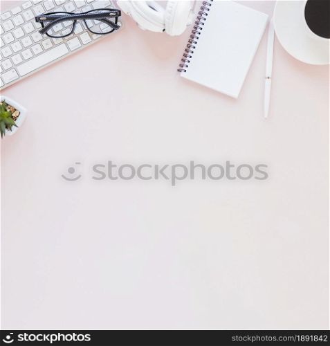 workplace with various gadgets notebook coffee cup pink background. Resolution and high quality beautiful photo. workplace with various gadgets notebook coffee cup pink background. High quality and resolution beautiful photo concept