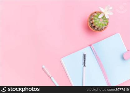 workspace desk styled design office supplies with cactus on pink pastel background minimal style