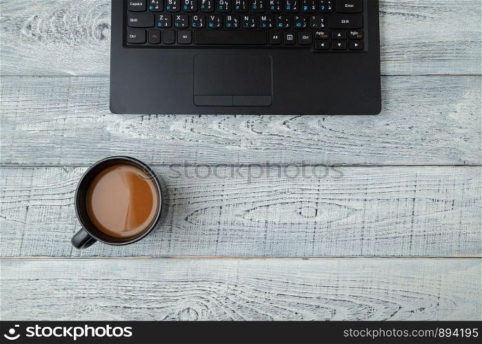 Workspace . laptop and Cup of coffee. minimalism. the view from the top. flat lay