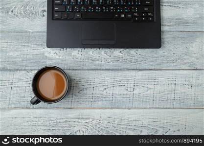 Workspace . laptop and Cup of coffee. minimalism. the view from the top. flat lay