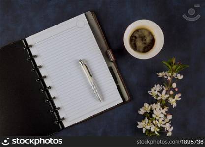 Workspace office table with blank notebook with coffee cup on pencil. Office table with blank notebook with coffee cup on pencil