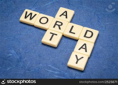 World Art Day - crossword in ivory letter tiles against textured handmade paper