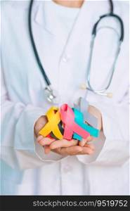 World cancer day, February 4. Doctor hold colorful ribbons, blue, yellow, red, green, white, pink and grey for supporting people living and illness. Health, Medical, awareness and Insurance concept