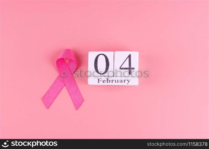 World cancer day with calendar of February 4 and Pink Ribbon supporting people living and illness. Healthcare concept