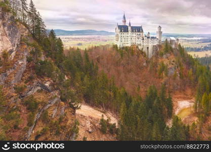 World-famous tourist attraction in the Bavarian Alps, fairytale Neuschwanstein or New Swanstone Castle, the 19th century Romanesque Revival palace at sunset, Hohenschwangau, Bavaria, Germany. Fairytale Neuschwanstein Castle, Bavaria, Germany