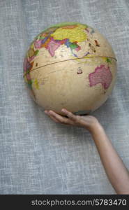 world globe detail in a woman hand