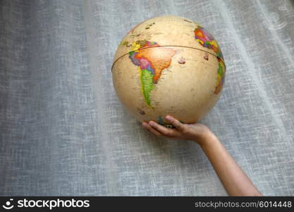 world globe detail in a woman hand