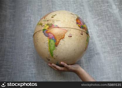 world globe in a woman hand detail